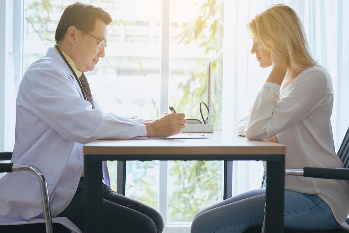 palm springs rehab centers woman and doctor discuss Palm Springs Rehab Centers